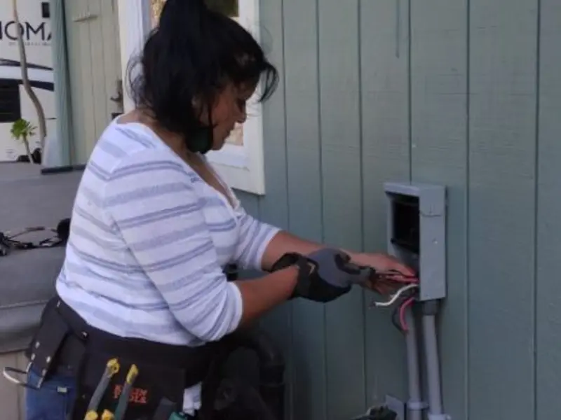 Licensed electrician wiring an exterior subpanel in Carthage