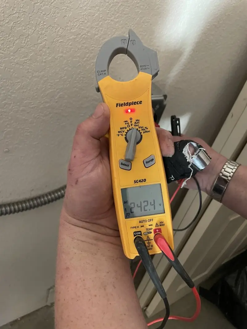 Voltage testing with clamp meter during Electrical Installation Services in Carthage